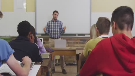 Teacher-talking-at-his-high-school-class