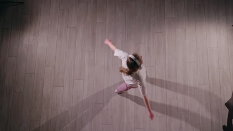 girl dancing to music at home