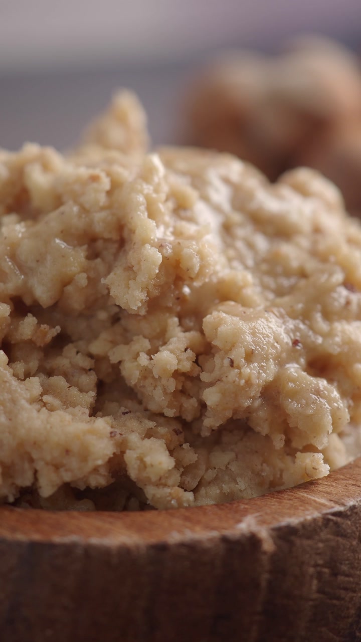 Close-up of Homemade Nut Butter in a Wooden Bowl