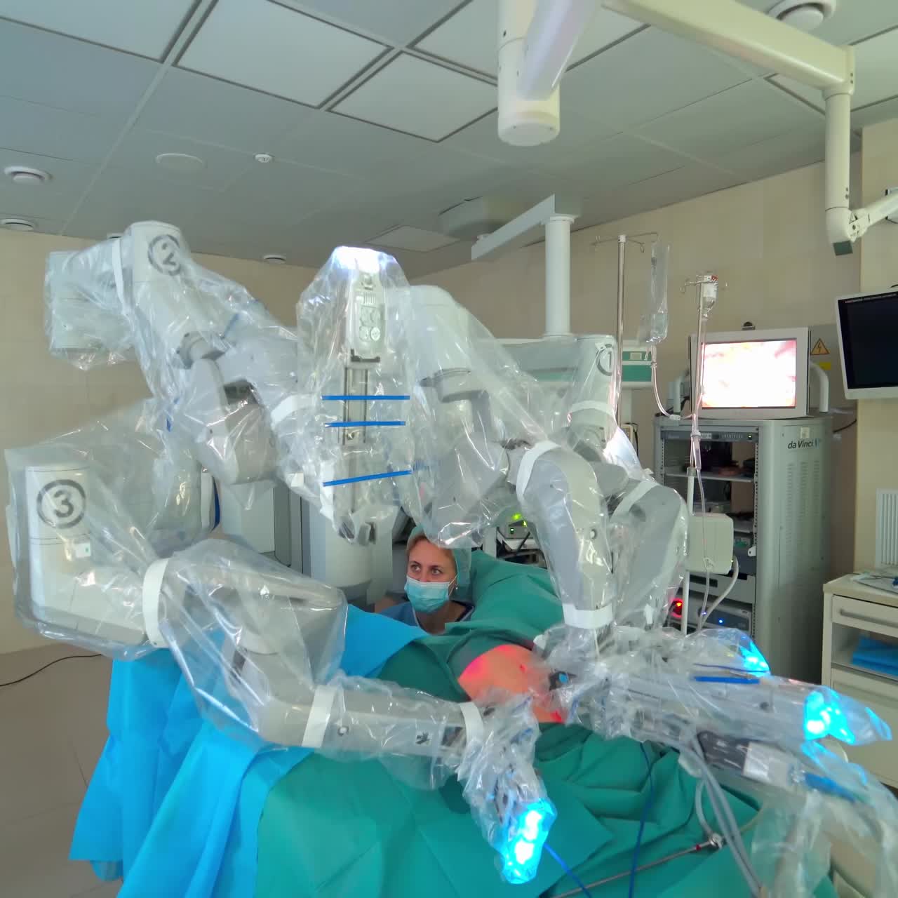 Surgical room with robotic equipment. Team of professional doctors operating surgery in hospital room