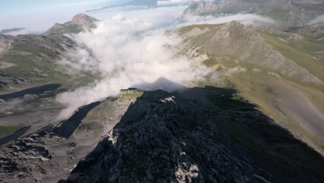 panoramic landscape of mountains and clouds, aerial fpv view