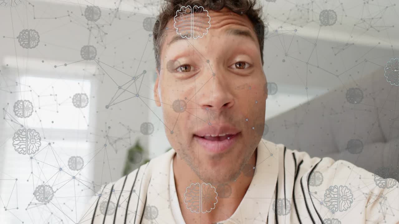 Man reaching to adjust camera in home, smiling and explaining tech idea, brain overlay appearing