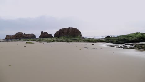 Natural-wide-sandy-beach-scene-with-negative-space-early-morning-50fps-Porto-Santo---Portugal-Static-Shot