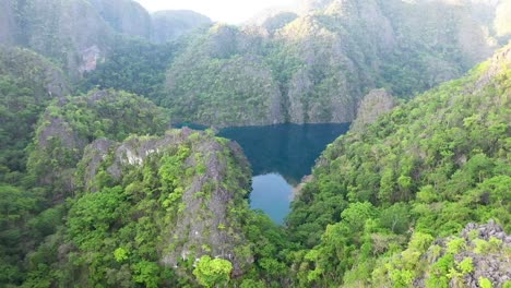 aerial view of dramatic scenery and turquoise ocean water at twin lagoon in coron island, palawan, philippines