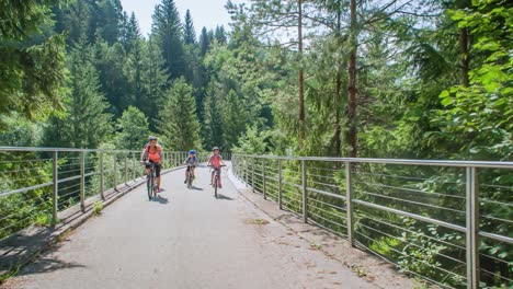 active family of four cycling in nature slovenia, tracking real-time