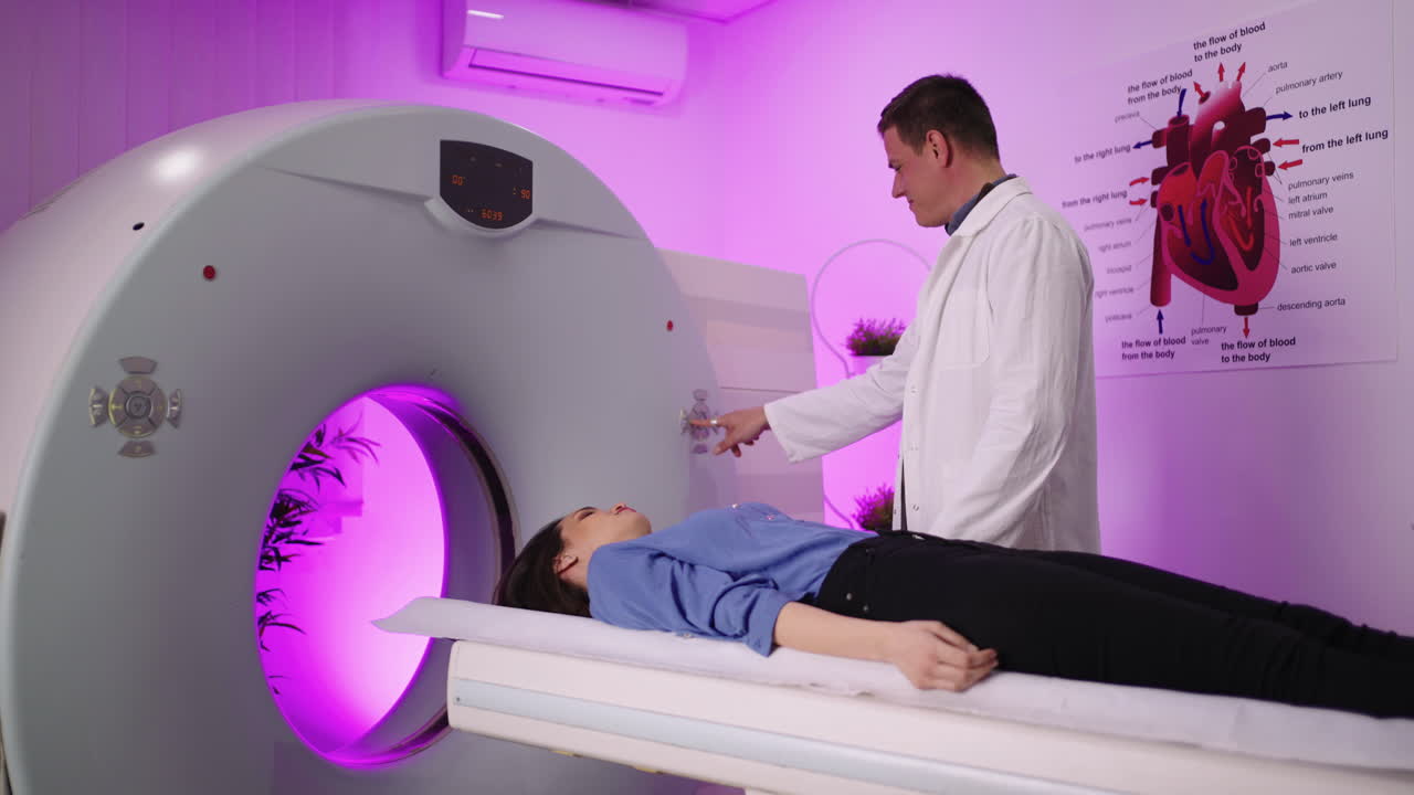Doctor preparing patient for a CT scan