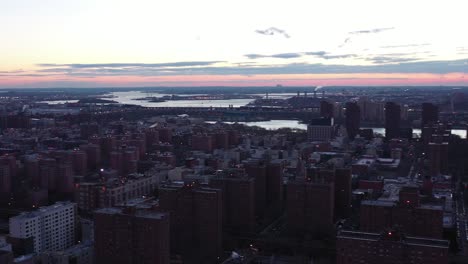 rotating drone panorama of harlem, new york city at sunrise