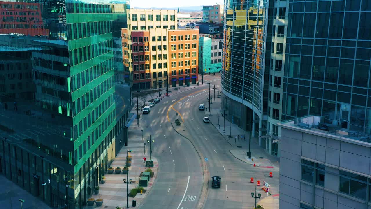 Drone panning around building to reveal empty street in downtown Denver during stay at home orders due to Covid-19