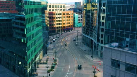 drone panning around building to reveal empty street in downtown denver during stay at home orders due to covid-19