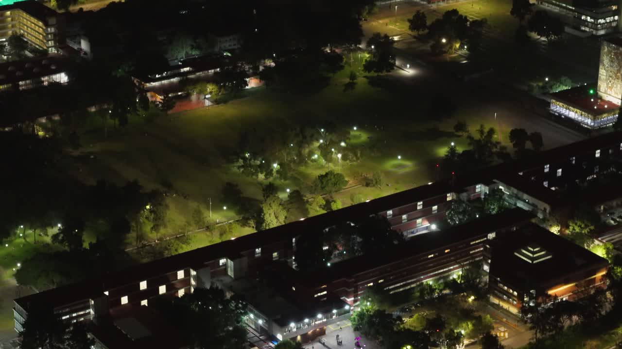 Aerial night shot showing illuminated structures on main campus