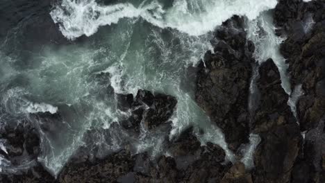 strong sea waves breaking on rugged shoreline