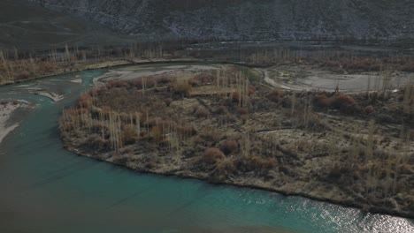 Aerial-View-Over-Winding-River-Bend-On-Valley-Floor-Landscape-Of-Gilgit-Baltistan