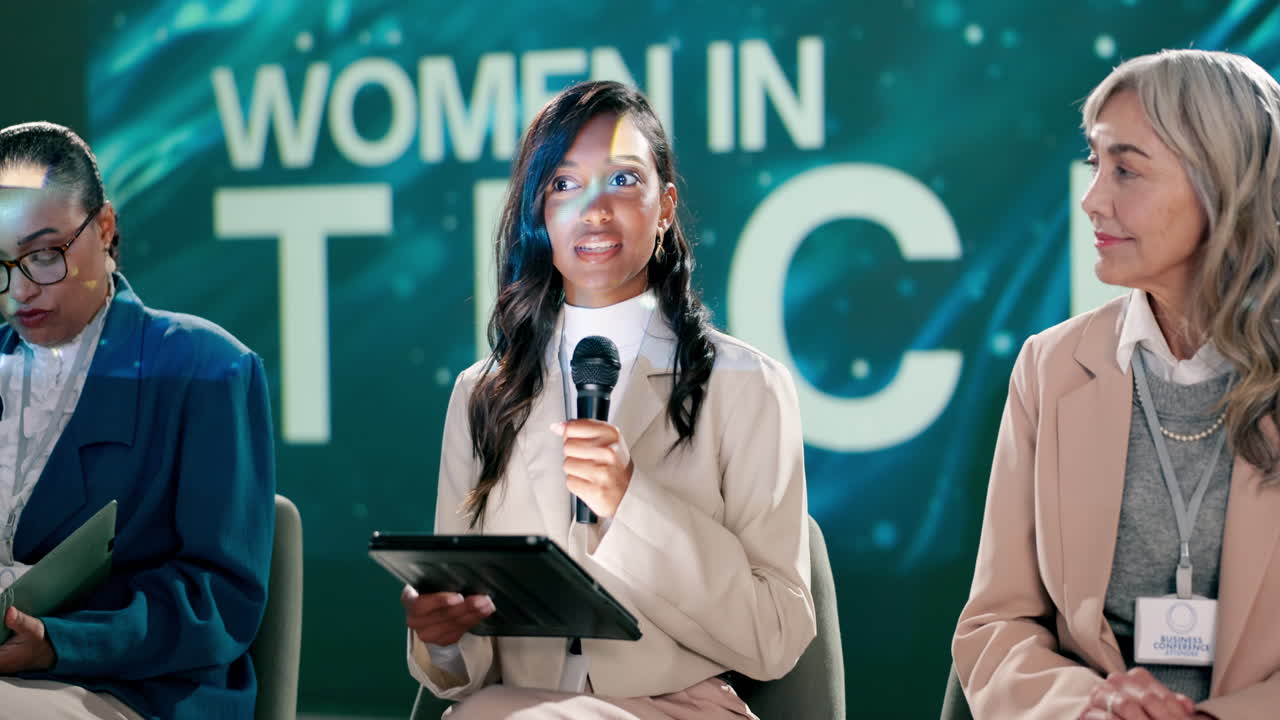 Panel of women speaking at a tech conference
