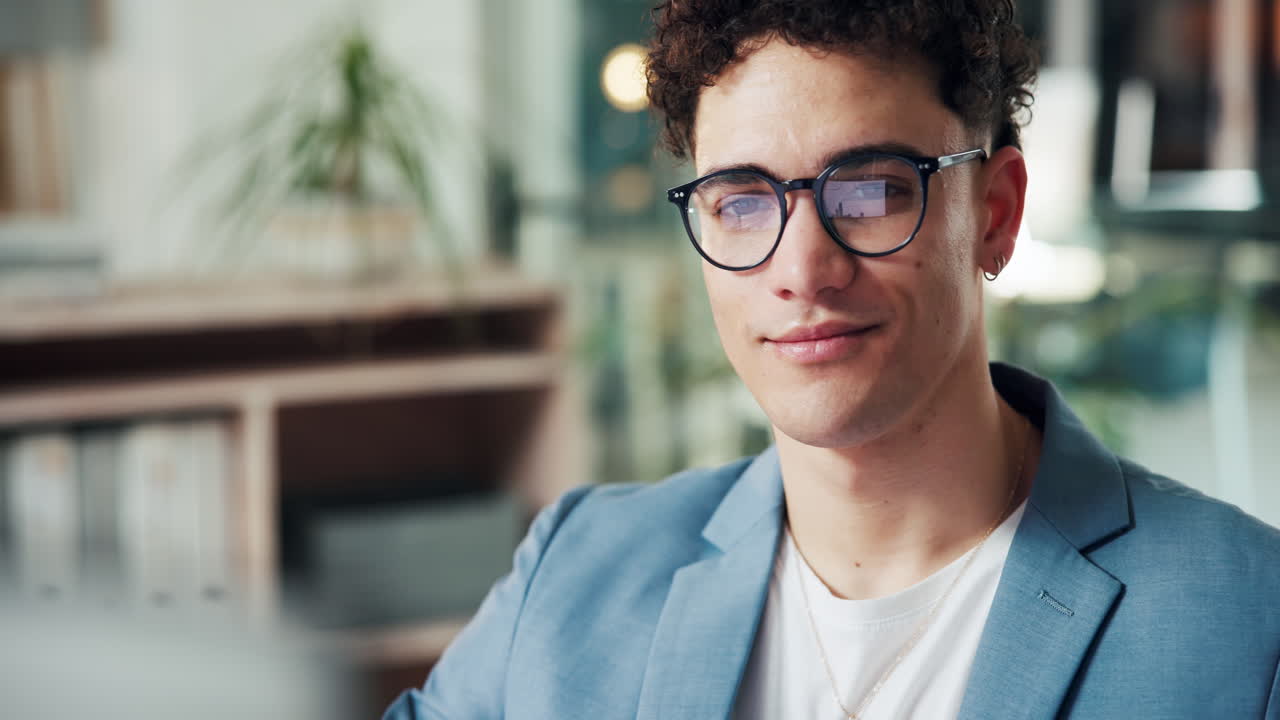 Man with glasses in office setting