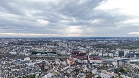 overcast skies frame le mans' skyline, blending medieval charm with motorsport