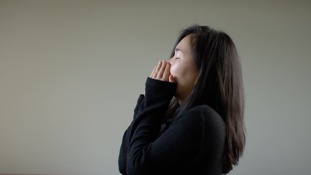 Asian Woman Sneezing in Slow Motion C