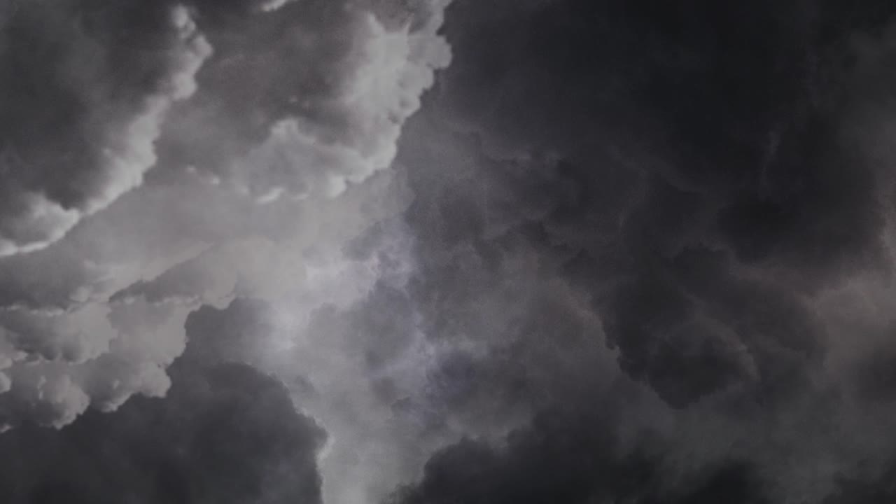 4k thunderstorm, in the dark cumulonimbus clouds at dusk