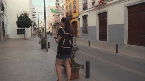 woman walking down a european street