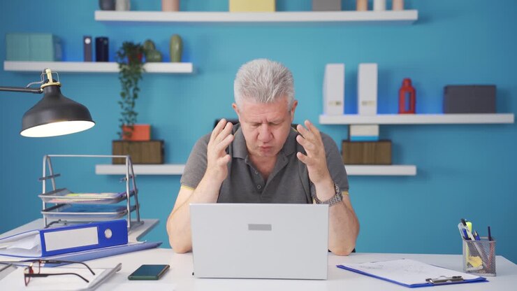 Home office worker man's hands are shaking.