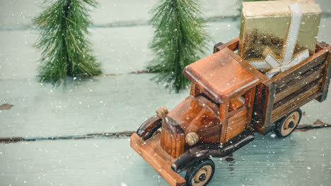 model car with a present on its roof combined with falling snow