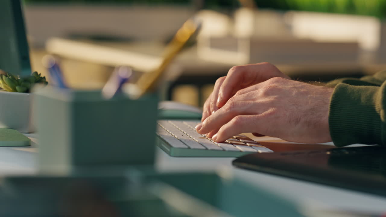 Freelancer hands typing keyboard office close up. Man fingers working computer