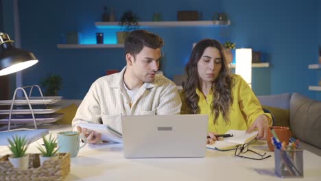 Married-couple-working-in-home-office-discussing,-brainstorming-about-a-topic.