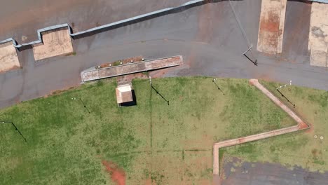 Aerial-drone-footage-of-an-empty-parking-lot-outside-a-stadium-used-for-concerts-and-soccer