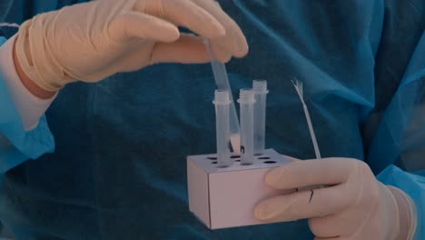 a healthcare worker prepares vials for the new covid-19 rapid testing