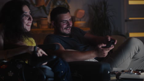 couple enjoying video games at home