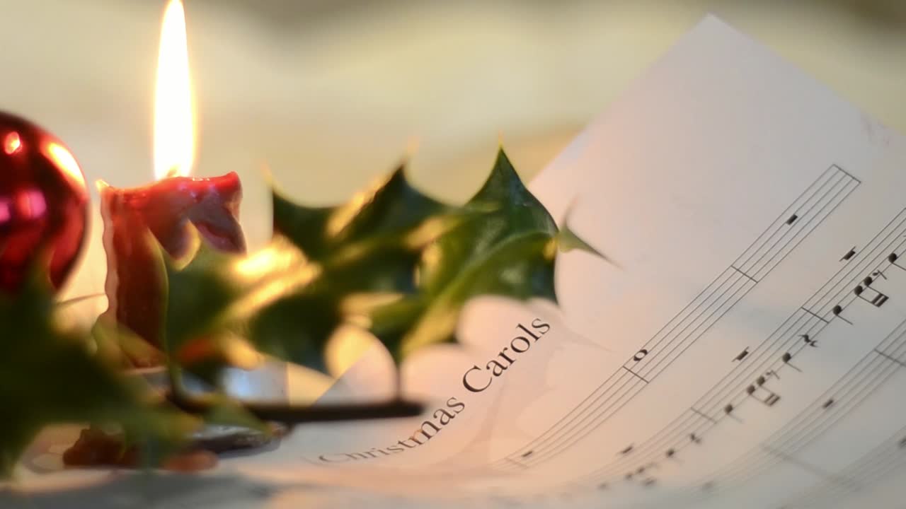 Christmas Carols Music with Candles and Holly