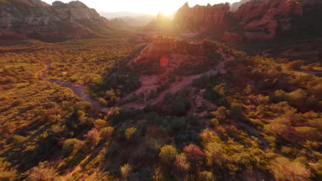 cinematic aerial drone shot of the lush green forest in sedona arizona during the golden hour