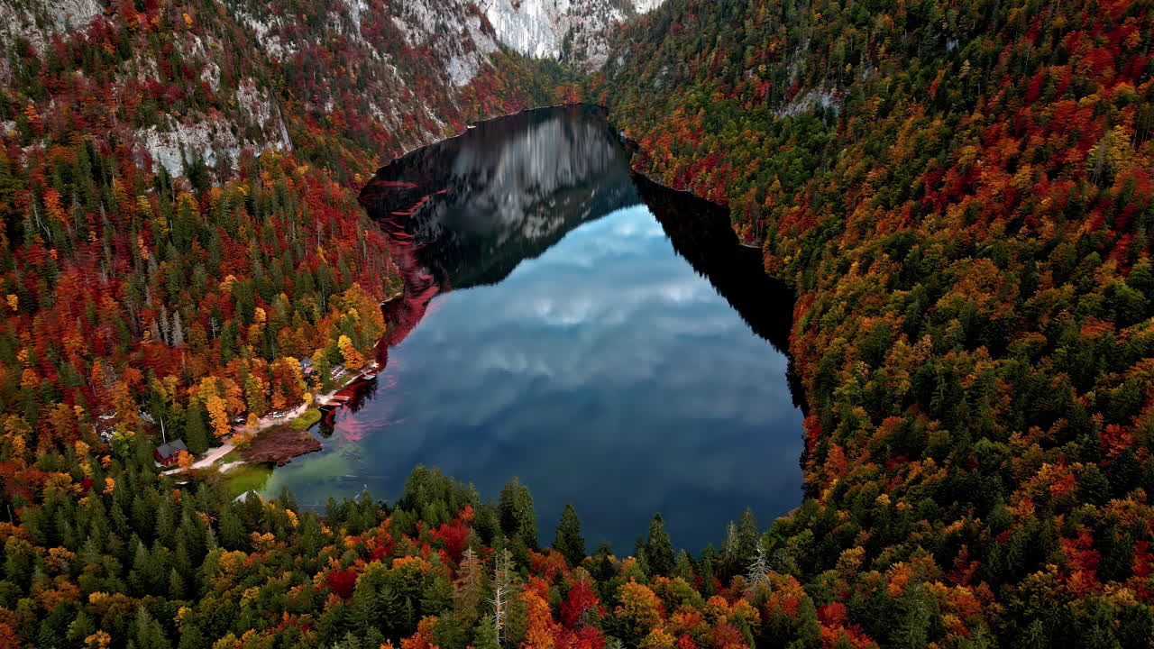 Aerial view of the Lake Toplitz, reflecting in middle of fall colored mountains