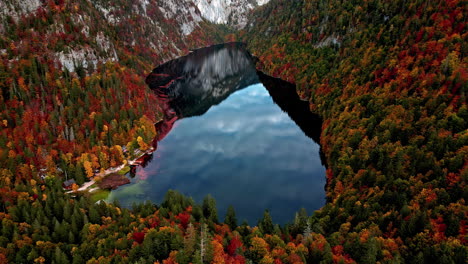 aerial view of the lake toplitz, reflecting in middle of fall colored mountains