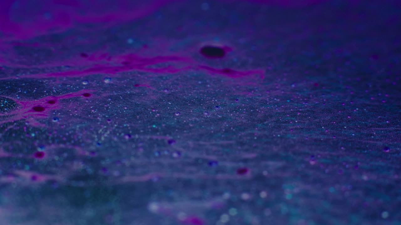 Colourful, organic, liquids macro shots buzzing and flowing