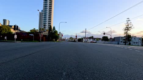 quiet urban street with skyscraper and sunset