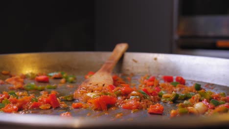 the cook throws the squid into the pan