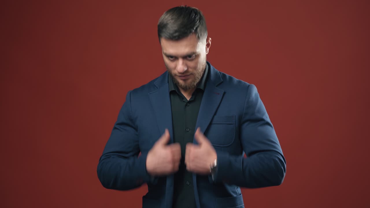 Hopeful businessman in studio background. Confident businessman posing on studio background