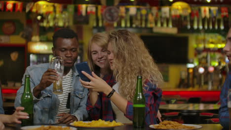 Group-Of-Happy-Multiracial-Friends-Making-A-Toast-With-Beer-At-Bar-Or-Pub.