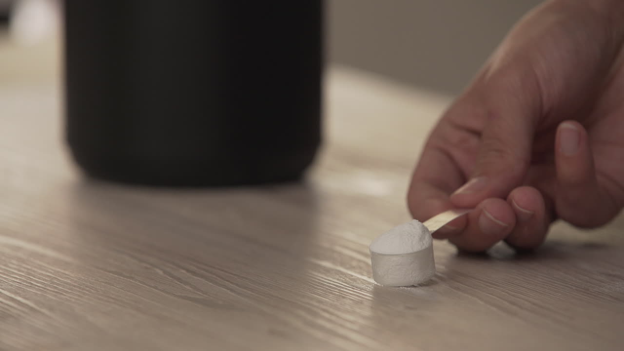 Showing a scoop of creatine powder