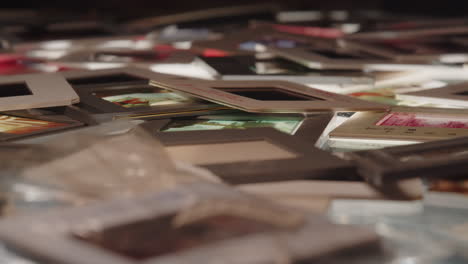 Background,-Pile-of-color-slides-on-backlit-table