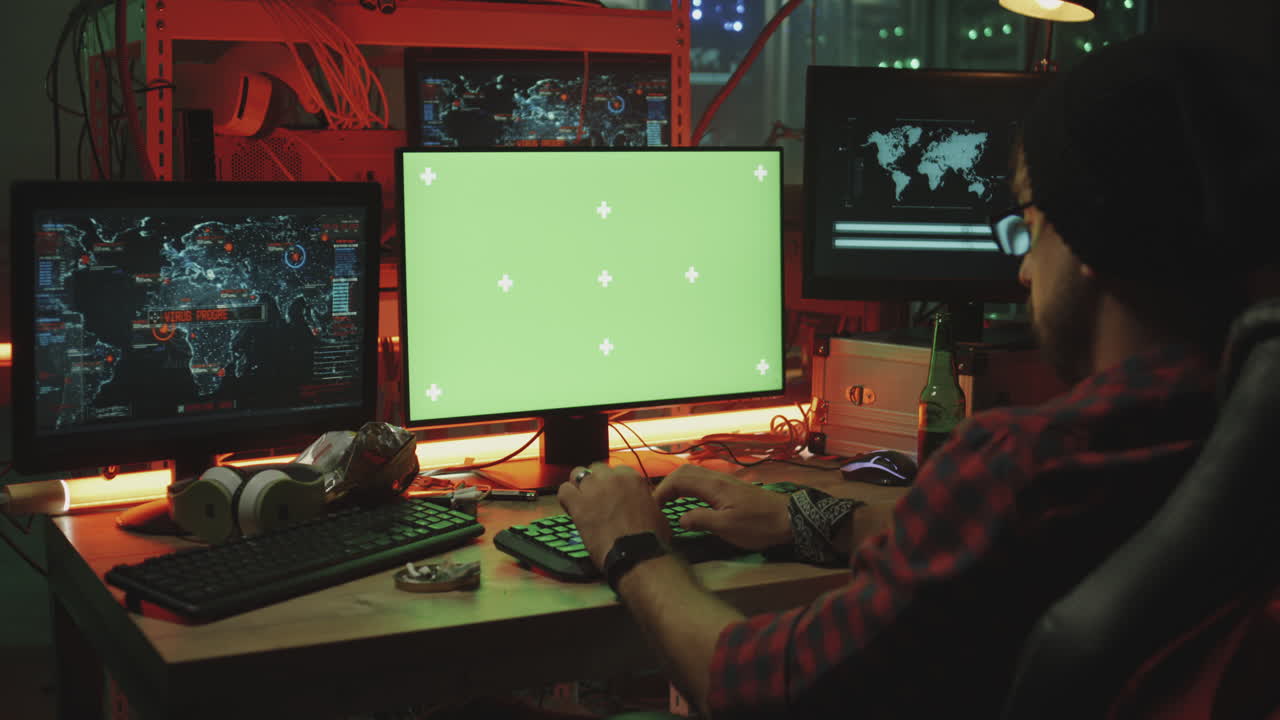 Hacker working at night in a server room