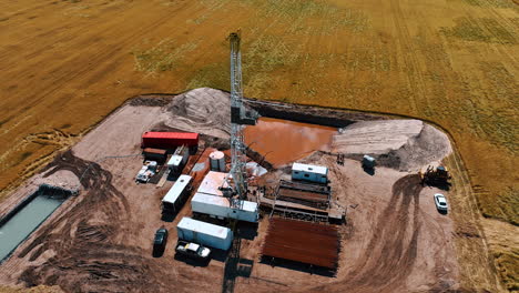 gas and oil industry in the onshore site located in the field. a number of metal pipes are prepared for the drilling process. top view.