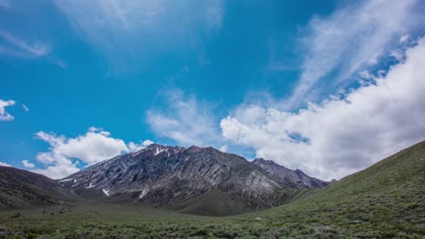 time lapse - beautiful cloudscape moving over mountain range