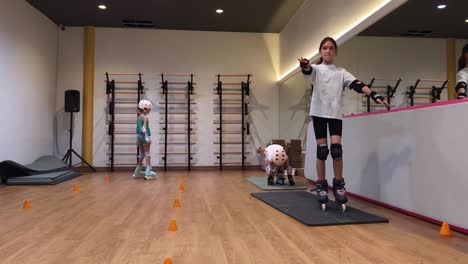 children learning roller skating in a gym