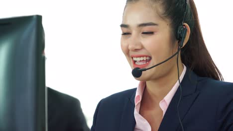 Business-people-wearing-headset-working-in-office