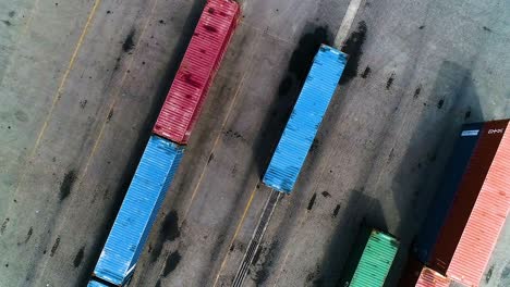 cargo shipping container box in port of puerto limon, caribbean, costa rica - aerial top down