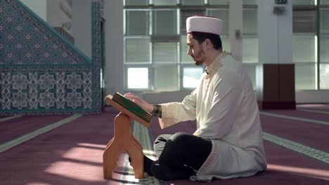 muslim man reading quran in mosque 1