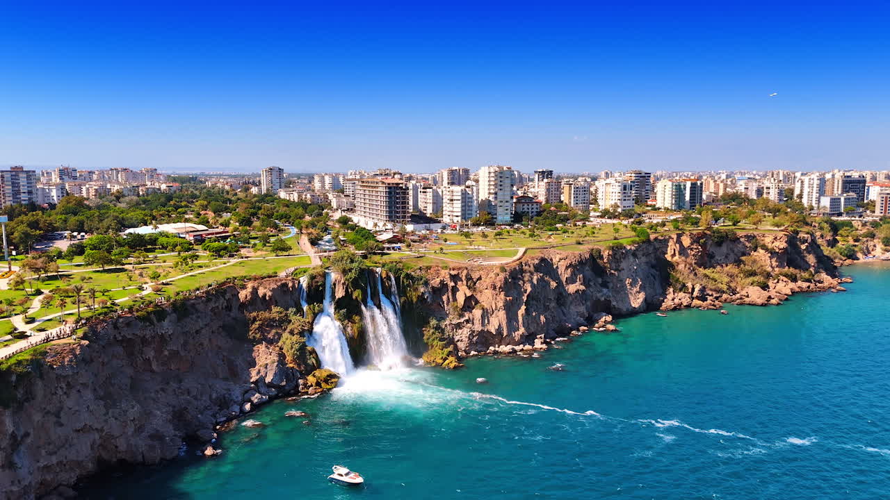 Rocky shore of the Mediterranean Sea with stunning waterfalls. Antalya landmark - Duden waterfalls in Turkey. Aerial view