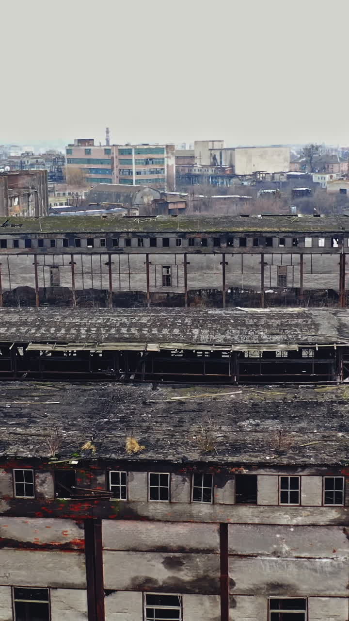 Aerial view of an abandoned industrial plant. Abandoned old chemical factory. Vertical video