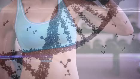 animation of dna strand spinning and data processing over strong woman exercising